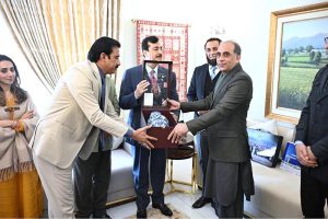 Chairman Senate Syed Yousaf Raza Gillani presents Souvenir to Mubashir Hassan Executive Director General /PIO in federal capital.