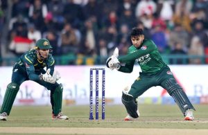Pakistani batter Usman Khan playing shot during the first Twenty20 International Cricket match between Pakistan and Australia at the Gaddafi Cricket Stadium.