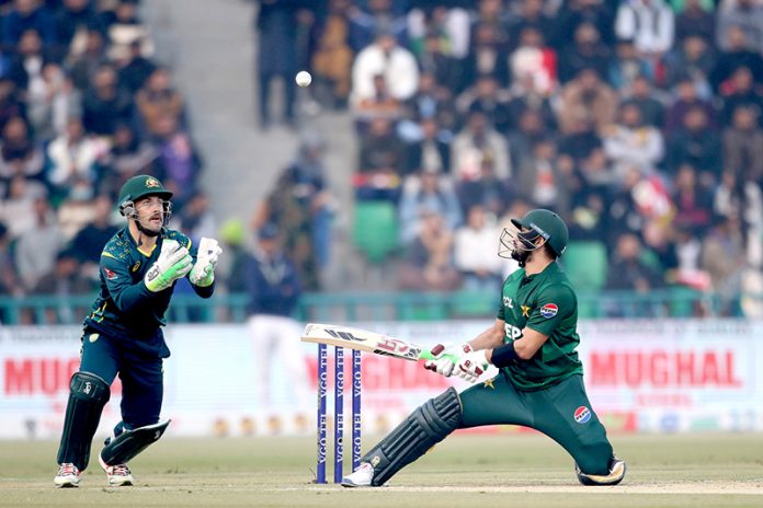 Australian wicket keeper Josh lnglis catch the Pakistani batsman Sahibzada Farhan ball by Kuhnemann during the second Twenty20 international cricket match between Pakistan and Australia at the Gaddafi Cricket Stadium