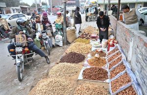 People purchase dry fruits at Jhang Moor