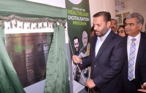 Federal Minister for National Health Services, Regulations and Coordination Syed Mustafa Kamal unveiling a plaque to inaugurate 1st Digitized Healthcare Center of city under the Federal Healthcare Digitalization Program
