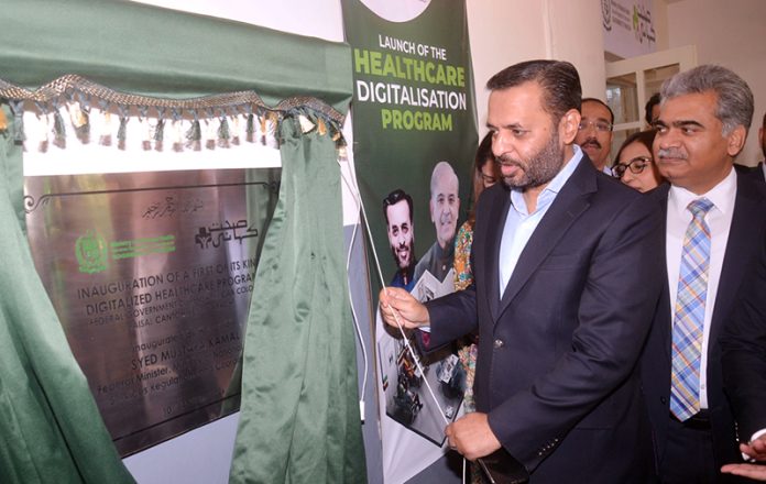 Federal Minister for National Health Services, Regulations and Coordination Syed Mustafa Kamal unveiling a plaque to inaugurate 1st Digitized Healthcare Center of city under the Federal Healthcare Digitalization Program
