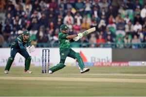 Pakistani batter Usman Khan playing shot during the first Twenty20 International Cricket match between Pakistan and Australia at the Gaddafi Cricket Stadium.