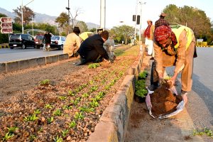 Young vendors selling floral bangles to attract customers at F-7 in the Federal Capital