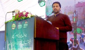 Provincial Minister for Transport Bilal Akbar speaks at the inauguration ceremony of the Green Electric Bus Service at Dring Stadium.