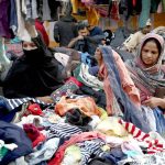 Women are busy selecting and purchasing warm clothes in the city following the recent cold wave in the provincial capital