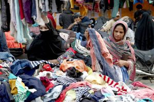 Women are busy selecting and purchasing warm clothes in the city following the recent cold wave in the provincial capital