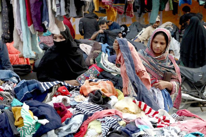 Women are busy selecting and purchasing warm clothes in the city following the recent cold wave in the provincial capital
