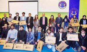 Federal Minister for Climate Change and Environmental Coordination Dr. Musadik Malik addresses the Laptop Distribution Ceremony at COMSATS University, Islamabad