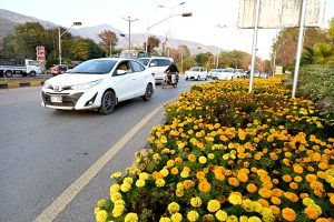 Young vendors selling floral bangles to attract customers at F-7 in the Federal Capital