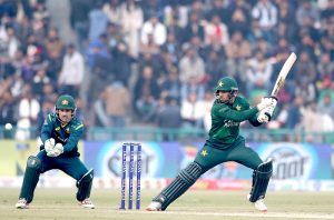 Pakistan’s batter Usman Khan plays a shot during the second Twenty20 international cricket match between Pakistan and Australia at the Gaddafi Stadium