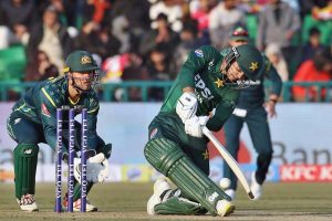 Pakistani batter Usman Khan playing shot during the first Twenty20 International Cricket match between Pakistan and Australia at the Gaddafi Cricket Stadium.