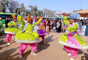Provincial Minister for Transport Bilal Akbar speaks at the inauguration ceremony of the Green Electric Bus Service at Dring Stadium.