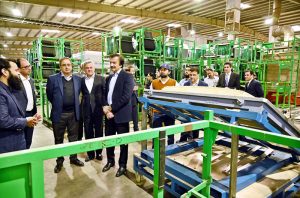 SAPM for Industries and Production Haroon Akhtar Khan inspecting a process of automotive glass manufacturing at the auto-glass processing unit during his visit of SME cluster at Bin Qasim.