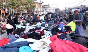A large number of citizens are busy selecting and purchasing warm clothes at the Empress Market in Saddar following the recent cold wave in the provincial capital.
