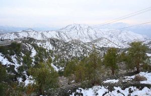 A scenic view of snow-covered mountains