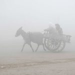 A view of thick fog that engulfs the whole city during morning time