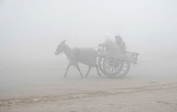 A view of thick fog that engulfs the whole city during morning time