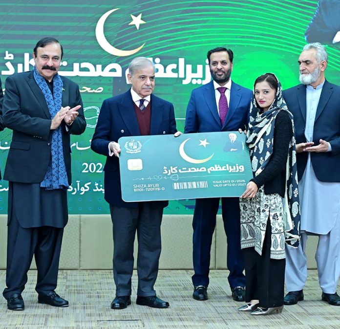 Prime Minister Muhammad Shehbaz Sharif presenting a symbolic health card to a resident of Islamabad to mark the launch of PM's Health Card scheme
