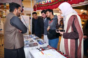 An artisan creating a piece of string art during International Tourism Conference & Exhibition Pakistan 2026 at a local hotel.