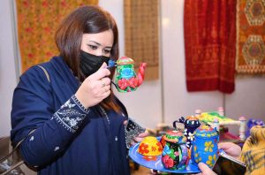 An artisan creating a piece of string art during International Tourism Conference & Exhibition Pakistan 2026 at a local hotel.