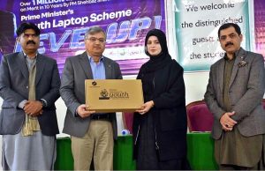 Vice Chancellor of Allama Iqbal Open University, Prof. Dr. Nasir Mahmood, distributes laptops to students under the Prime Minister’s Youth Laptop Scheme at the Regional Campus Gujranwala
