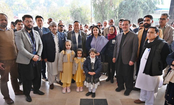 Chairperson, Benazir Income Support Programme (BISP), Senator Ms. Rubina Khalid, poses for a group photo with participants after inaugurating the Nutrition Stabilization Center supported by BISP and WHO at Bacha Khan Medical Complex