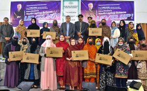 Vice Chancellor of Allama Iqbal Open University, Prof. Dr. Nasir Mahmood, distributes laptops to students under the Prime Minister’s Youth Laptop Scheme at the Regional Campus Gujranwala