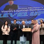 Federal Minister for Industries and Production Rana Tanveer Hussain and University of Sargodha Vice Chancellor Prof. Dr. Qaiser Abbas distribute laptops to students during the Prime Minister Laptop Scheme Regional Distribution Ceremony at the University of Sargodha