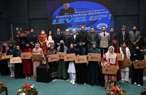 Federal Minister for Industries and Production Rana Tanveer Hussain and University of Sargodha Vice Chancellor Prof. Dr. Qaiser Abbas distribute laptops to students during the Prime Minister Laptop Scheme Regional Distribution Ceremony at the University of Sargodha