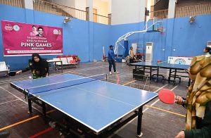 Students participate in table tennis trials during the “Khelta Punjab Pink Games Trials” held at the sports gymnasium.