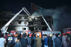 Firefighters douse water to extinguish fire at Gul Plaza.