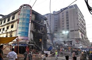 Firefighters douse water to extinguish fire at Gul Plaza.