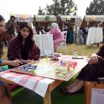 Young girls enjoy a game of ludo at the newly launched Community Market set up by the Capital Development Authority (CDA), aimed at promoting youth entrepreneurship and supporting local businesses amid the rising trend of informal pop-up markets in the Federal Capital