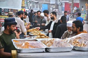 - People busy purchasing traditional food items for iftari at Ghouri Town during Holy Fasting Month of Ramazan.