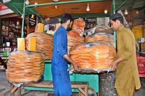 A vendor arranging and displaying ‘pheni’ to attract the customers during the holy month of Ramazan in a local market. APP/SFD/TZD