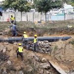 Workers are busy placing stones under the gas pipeline to support it during maintenance work in the Federal Capital