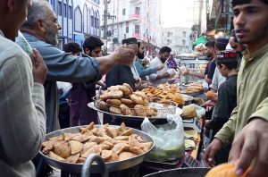 A vendor displaying fruits on his cart to attract customers at Ghori town in the Federal Capital