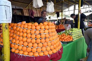 People purchase dates from Ramazan Sahulat bazaar during the holy fasting month of Ramazan-ul-Mubarak at Aabpara Market in the Federal Capital