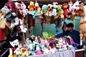 A vendor displaying and selling used toys on their handcart near Mayo Hospital in the Provincial Capital
