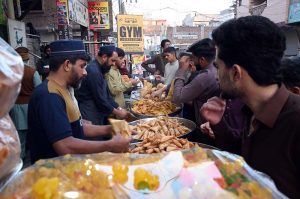 A vendor displaying fruits on his cart to attract customers at Ghori town in the Federal Capital