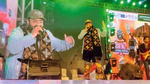 Girls look at artificial jewelry displayed for sale during the Faiz Festival at Alhamra