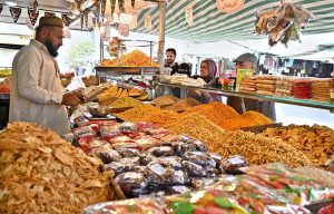 A vendor displaying and selling Dates to attract customers ahead of Ramazan ul Mubarak at H-9 bazaar in the Federal Capital.