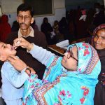 A health worker administers polio vaccine drops to a child during an anti-polio campaign at Government Bhitai Hospital.