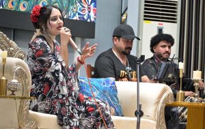 A student performs on stage during the Singing Competition (Folk & Ghazal) at Islamabad Model College for Girls (PG), G-10/4.