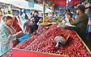 A vendor displaying and selling Dates to attract customers ahead of Ramazan ul Mubarak at H-9 bazaar in the Federal Capital.