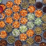A volunteer arranges Iftar for the faithful to break their fast during the holy fasting month of Ramazan at Madarsa Jamia Ishatul Quran Wal-Hadees, Dodai Road