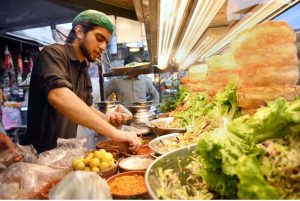 A vendor selling and displaying traditional food item dahi baray during the Holy fasting month of Ramazan at Food Street.