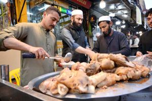 A vendor selling and displaying traditional food item dahi baray during the Holy fasting month of Ramazan at Food Street.