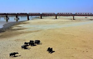 The dry bed of the Indus River at Hussenabad reflects the current water shortage, affecting irrigation, farming, and daily life in surrounding areas.